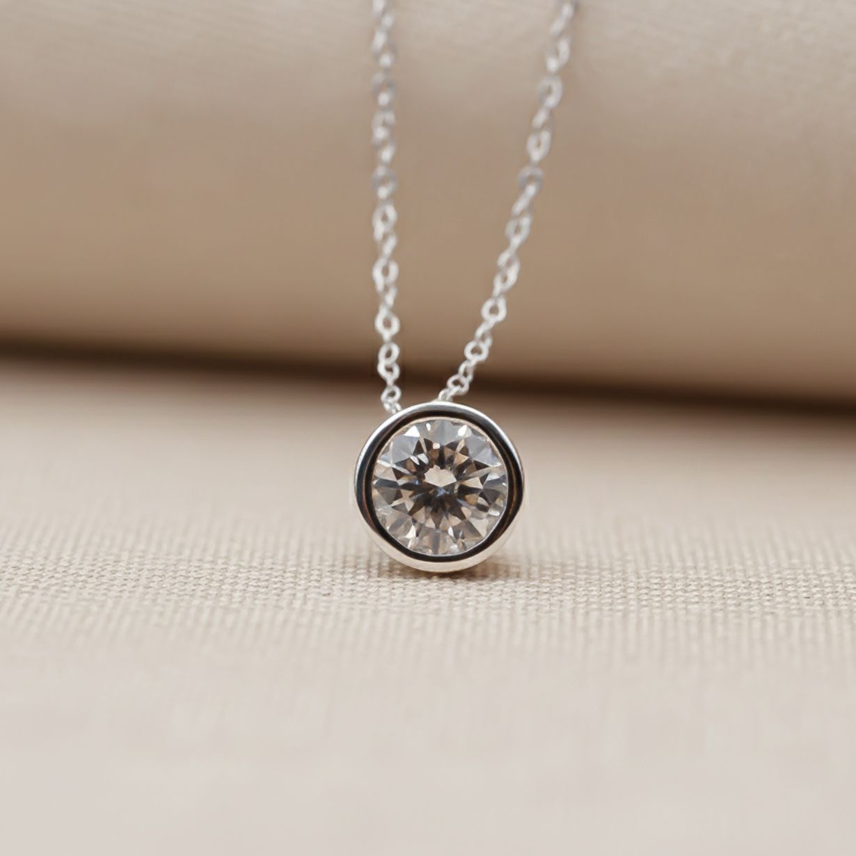 Bezel-set moissanite solitaire pendant