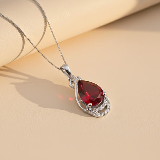 Silver Teardrop Ruby Pendant with CZ Curve