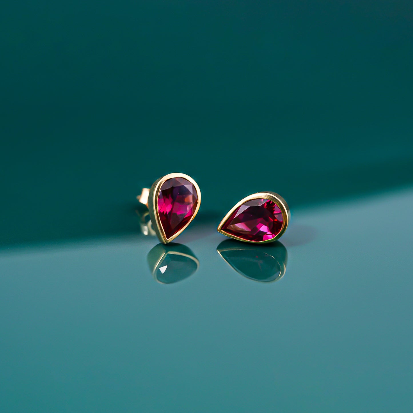 Golden Pear Shape Ruby Stud Earrings